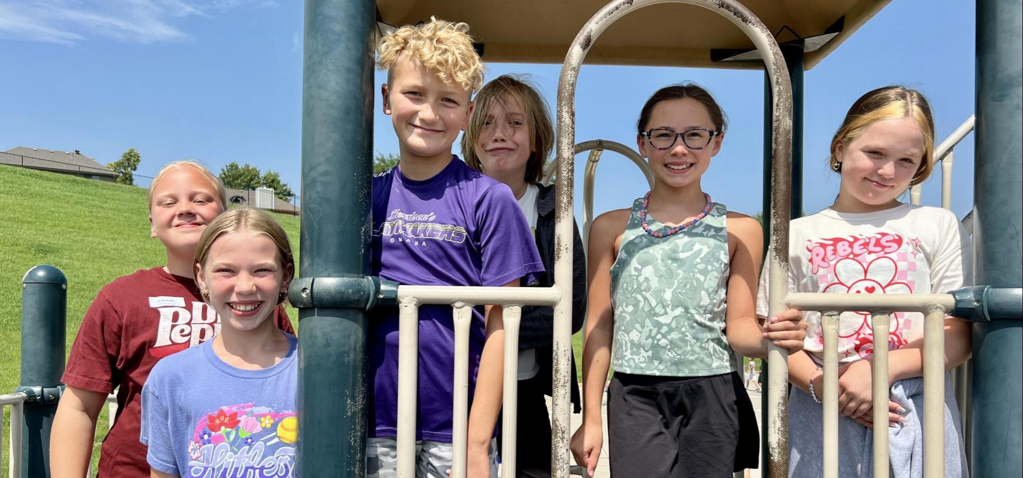 bunch of kids on playground equipment