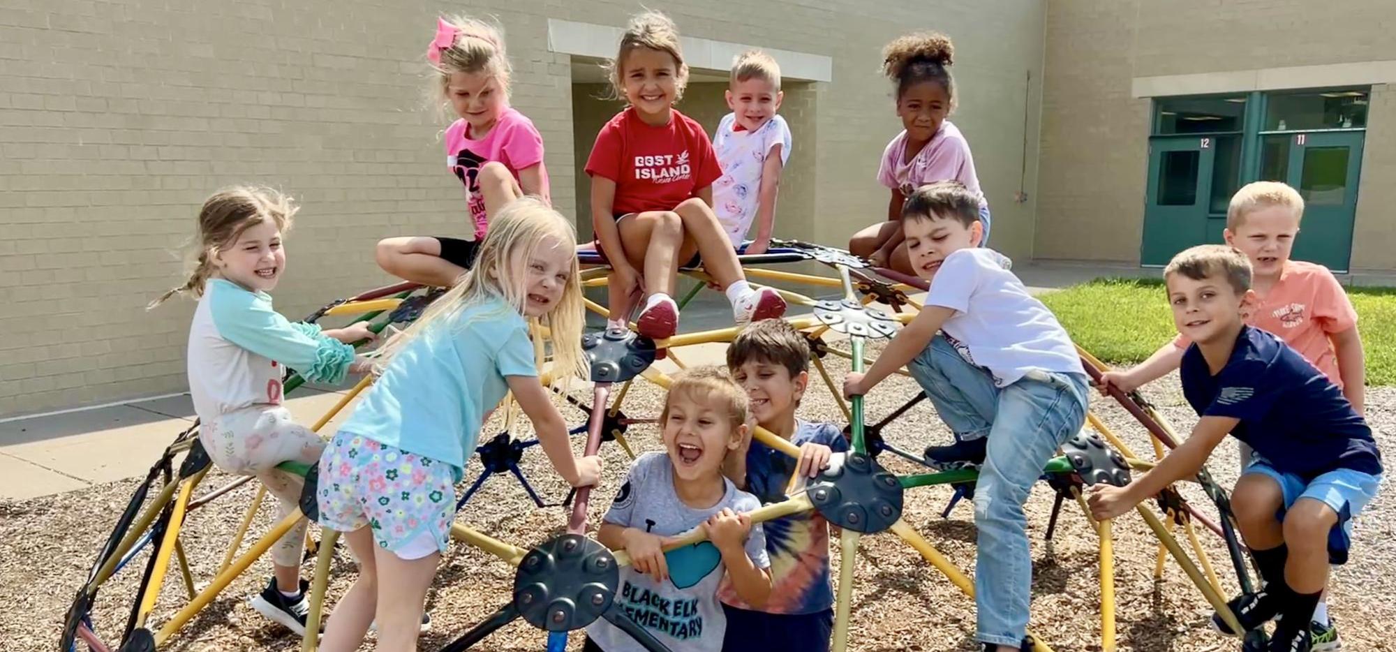 bunch of kids on playground equipment